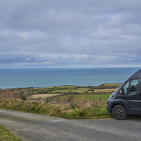 mobile home parked high on a cliff along the coastline. Pembroke shire, Wales - 03 01 2023: mobile home parked high on a cliff along the coastline of the atlantic ocean in Wales.